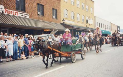 Photo submitted - For the first time in more than 10 years, the WNC Wagon Train is returning to Franklin this week. Pictured: A previous Wagon Train parade in downtown Franklin.