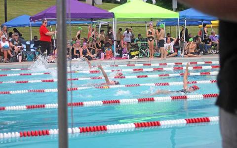 Press photo/Will Woolever - FAST swimmers ages 11-12 compete in the 200-yard medley relay June 12 at the Macon County Rec Park. From left are Naomi Green, Wylie Hinton and Larken Lynch.