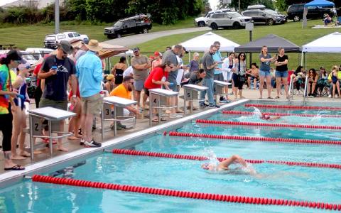 Press photo/Will Woolever - Emma Tyte (foreground) and Camila Gomez swim to a photo finish in the girls 9-10 50-yard freestyle at the Franklin Amateur Swim Team’s season opener June 5. 