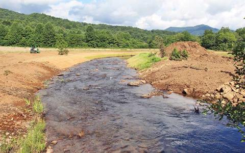 Press photo/Shelby Powell - Contractors are continuing to work on rebuilding and enhancing the riverbank along Jones Creek, next to Maiden’s Chapel.