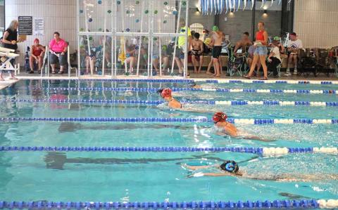 Press photo/Will Woolever - FAST’s Madelyn Kennedy (left) and Leila Pinkston (second from bottom) swim a close race in the girls 11-12 50-yard breastroke at the Mountain Swimn League All-Star meet July 19.