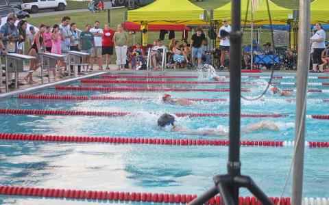 Press photo/Will Woolever - FAST’s Savannah Jessup (foreground) and Allison Stockton race to a photo finish in the girls 11-12 50-yard freestyle June 26. 