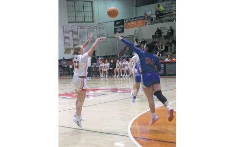 McKenna Plemmons attempts a 3-point shot versus West Henderson Jan. 14. In a rematch with the Falcons three weeks later, the senior broke a Panther single-game record with eight makes from behind the arc. (Press file photo)
