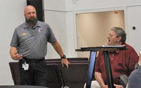 Press photo/Shelby Powell - Joey Gibson speaks at the Aug. 21 Behavioral Health Task Force meeting as Ronnie Beale listens. 