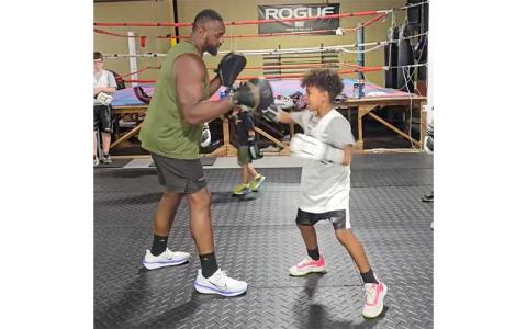 Photo courtesy of Jeffrey Epps - Local boxer Jeffrey Epps (left) spars with student Jameson Wilson during a class at Kavod Fitness. Epps recently won the first two fights of his amateur heavyweight career. 