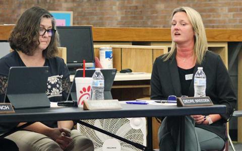 Press photo/Shelby Powell - Diedre Breeden (right) discusses cell phone policy at the Board of Education’s Sept. 22 meeting as board member Melissa Evans listens.