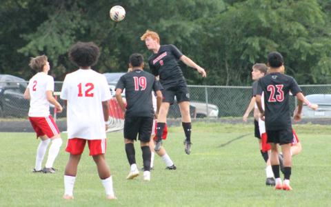 Press photo/Will Woolever.  Junior center back Malik Walker heads a ball away from danger versus Hendersonville at Macon Middle School Aug. 27.