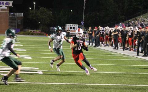 Press photo/Will Woolever - Senior Payton King eyes the end zone on an 18-yard touchdown reception in Franklin’s 59-0 rout of East Henderson Sept. 11.