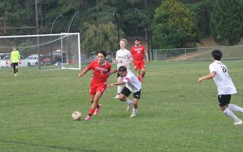Press photo/Will Woolever - Junior Kevin Torres (left) evades a Tuscola defender during his hat trick (three-goal) match at Macon Middle School Sept. 22. 