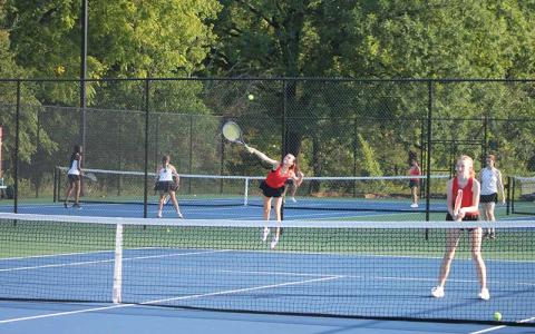 Press photo/Will Woolever - Senior Marlee Barnes (left) serves while Clara Stork guards the net in Franklin’s #1 doubles match versus Rabun Gap Sept. 3.