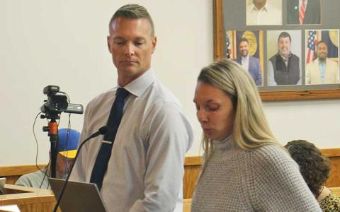 Press photo/Shelby Powell - Superintendent Josh Lynch and Macon County Schools Finance Officer Alayna Ledford speak to commissioners about the school’s budget shortfall.