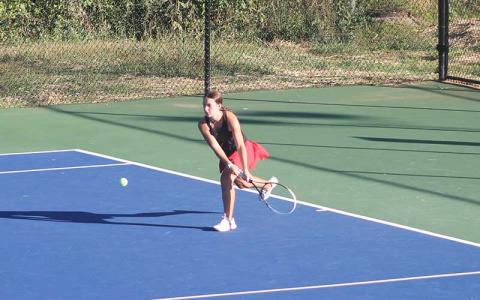 Press photo/Will Woolever - Sophomore Elise Phillips prepares to hit a difficult groundstroke versus West Henderson Oct. 1.