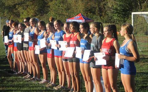 Press photo/Will Woolever - Abigail Timan (left), Amy Mendoza Lopez (second from left) and Morgan Cress (right) show off their All-Conference plaques after finishing among the top 14 girls in the Mountain Eight Championship meet in Hendersonville Oct. 14. 