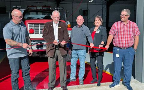 Press photo/Mia Overton - Mayor Jack Horton cuts the ribbon for the Franklin Fire & Rescue substation on NP&L Loop along with Fire Chief Ben Ormond, Vice Mayor Stacy Guffey, Town Manager Amie Owens and Town Planner Justin Setser, who is also a member of the fire department.