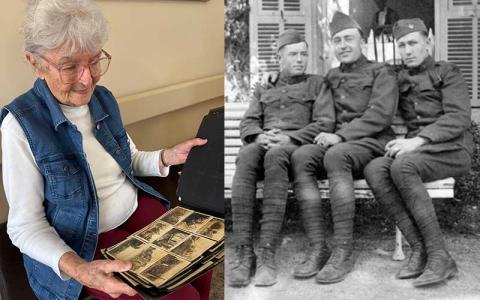 Press photo/Mia Overton - Marilyn Miller looks at photo album from World War I that belonged to her father, Leon Healy, who is pictured in the middle of the photo at right. 