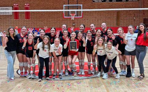 Photo submitted - Macon Middle School volleyball shows off their fourth-straight championship plaque after defeating Smoky Mountain in the Blue Ridge Athletic Conference Final. 