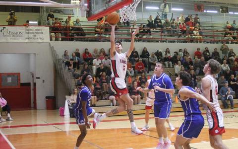 Press photo/Will Woolever - Senior Jack Teesateskie elevates to the rim versus Brevard Dec. 16.