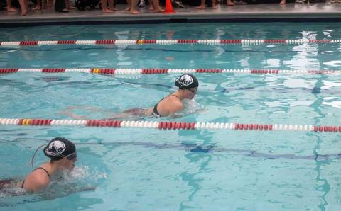 Press photo/Will Woolever - Franklin High School’s Lana Walker (left) and Kenna Keyworth swim a close race in the girls 100-yard breaststroke at Franklin Health and Fitness Dec. 6. 