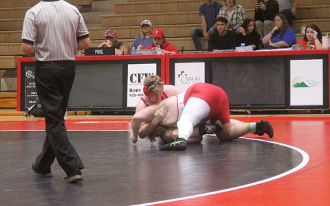 Then-freshman Devlin Bailey (left) battles a Rabun County wrestler in the heavyweight class last winter. (Press file photo)