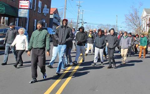 Press photo/Shelby Powell - Dozens of locals bundled up to celebrate MLK Day on Sunday, meeting first at the gazebo downtown and marching up Main Street to Franklin First United Methodist Church to remember Dr. Martin Luther King Jr., to celebrate his accomplishments in life and to acknowledge where his work has not yet been completed. 