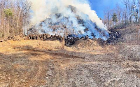 Photo/ Ryan Gearhart - The stump dump fire can be seen smoldering following hours of firefighting on Jan. 1. 