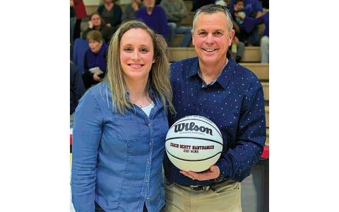 Press file photo - Former head coach Scott Hartbarger receives a commemorative basketball from Panther all-time leading scorer Lindsay Simpson after earning his 200th career win for Franklin in 2020. 