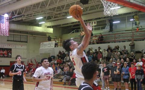 Press photo/Will Woolever - Jack Teesateskie elevates to the rim versus North Buncombe Dec. 2. The senior broke team records for points (52) and 3-pointers (12) in a single game versus Union County, Georgia, Dec. 30.