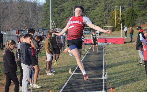 Press file photo - Senior CJ Engert competes in the long jump in Franklin’s home meet at Macon Middle School Dec. 3.