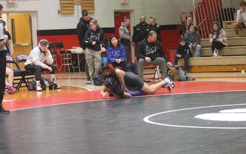 April Perez battles a wrestler from Smoky Mountain on Tom Raby Court last year. (Press file photo)