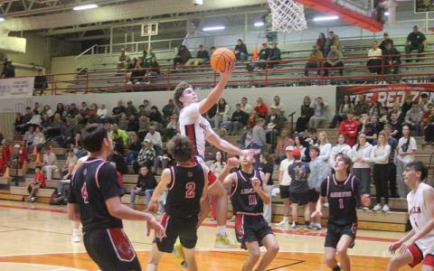 Press photo/Will Woolever - Junior Will Rauers elevates to the rim versus Andrews Jan. 5. 