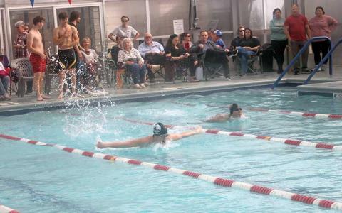 Press photo/Will Woolever - Thatcher Daniels swims a close race in the boys 100-yard butterfly at a FHS/MEC home meet Dec. 6