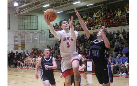 Press photo/Will Woolever - Jack Teesateskie elevates to the rim versus Smoky Mountain Feb. 6.