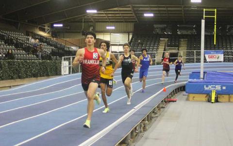 Press file photo - Junior Ken Modlin runs the 500-meter dash in the Mountain Eight Conference Championships Jan. 29. 