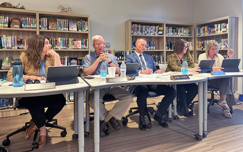 Highlander photo/Mitch Stone. Board Chairman Jim Breedlove (second from left) discusses fundraising requests during the Macon County Board of Education meeting on Monday, March 23, at Highlands School. 