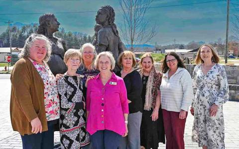 Photo/Bob Scott - Nancy Siler Scott (second from left) was honored as the 2026 Macon Matriarch. The award is presented by the Folk Heritage Association of Macon County. Scott is pictured at the Sowing the Seeds of the Future sculpture with FHAMC board members Claire Suminski, Theresa Ramsey, Janet Greene, Anne Hyder, Marty Greeble, Mia Overton and Mary Polanski. Susan Ervin, not pictured, also served on the selection committee.