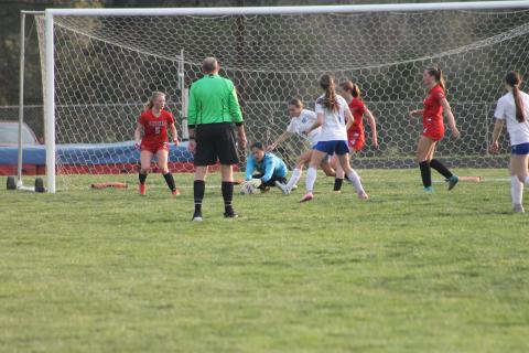 Press photo/Will Woolever. Goalkeeper Carramia Ramos corrals a loose ball versus Polk at Macon Middle School March 20. The senior captain has held Franklin’s opponents to one goal combined, helping earn three wins and a tie.