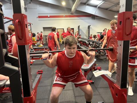Press photo/Will Woolever.  Wesley Maxson performs a barbell back squat during a Bigger, Faster, Stronger physical education class at Macon Middle School recently.