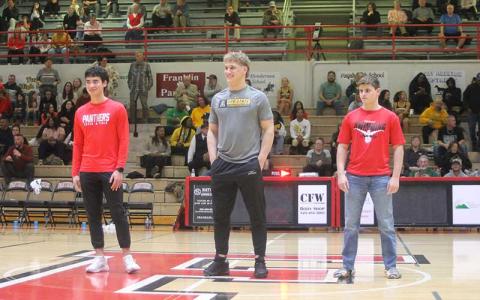 Press photo/Will Woolever - Franklin’s winter sports state champions are recognized at center-court during a Panther hoops home playoff game Feb. 26. From left are Ken Modlin (track and field), Garrett Young (wrestling) and Jonah Brant (diving).