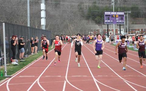 Press photo/Will Woolever - Gabe Harrison (second from left) runs the 100-meter dash at WCU March 6. 