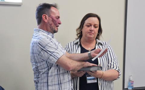 Press photo/Shelby Powell. David Culpepper is sworn in as a Macon County Planning Board member by Planning Department administrative assistant Tara Mellies. Culpepper was elected to serve as board chair.