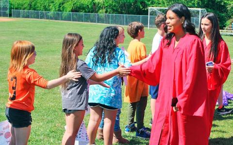 Press photo/Shelby Powell - South Macon Elementary students greet Franklin High School seniors Evelyn Sastre and Madison Stamey.