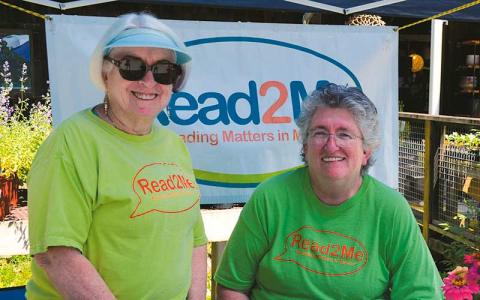 Press file photo - Diane Cotton (right) was often seen at community events giving out free children’s books for Read2Me. She is pictured with Lee Berger at a Family Fun Day at Winding Stair Gardens in 2024.