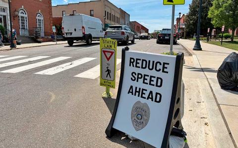Press photo/Mia Overton - A new sign at the top of Town Hill reminds drivers of the reduced speed along Main Street. 