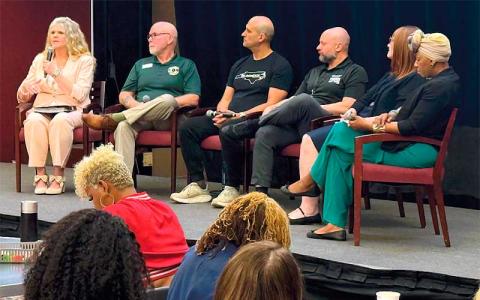 Photo submitted - Macon County Veteran Services director Leigh Tabor (left) speaks with other veterans and veteran advocates at the Governor’s Institute on a panel to bring awareness to organizations and activities that can provide community and support to vets.
