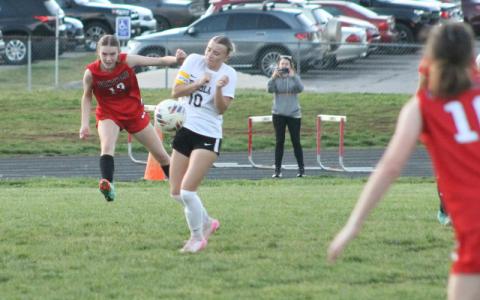 Press photo/Will Woolever. Junior captain/center back Sadie Collins clears a ball from danger versus Tuscola April 1. 