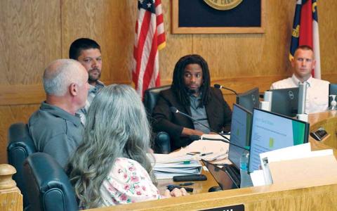 Press photo/Shelby Powell - County commissioners listen to the budget presentation at the May 12 meeting.