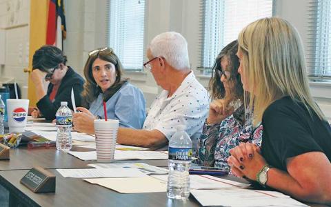 Press photo/Shelby Powell - From left: Stephanie Laseter, Hilary Wilkes, Jim Breedlove, Melissa Evans and Diedre Breeden discuss its expected ask for local funding, to be delivered to Macon County Commissioners ahead of a Thursday, May 21, county work session. 