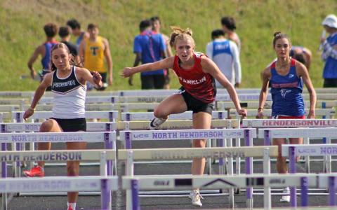 Anna Timan competes in the 100-meter hurdles at the Mountain Eight Conference Championships at North Henderson April 30. (Press file photo)