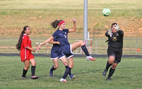 Fourth-year student Rachel Green scores one of her three goals in an exhibition match versus Franklin High School's JV team April 23. (Press photo/Will Woolever)