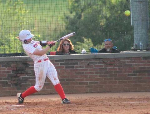 Suzanna Cabe knocks a ball into center field versus West Henderson April 28. (Press photo/Will Woolever)